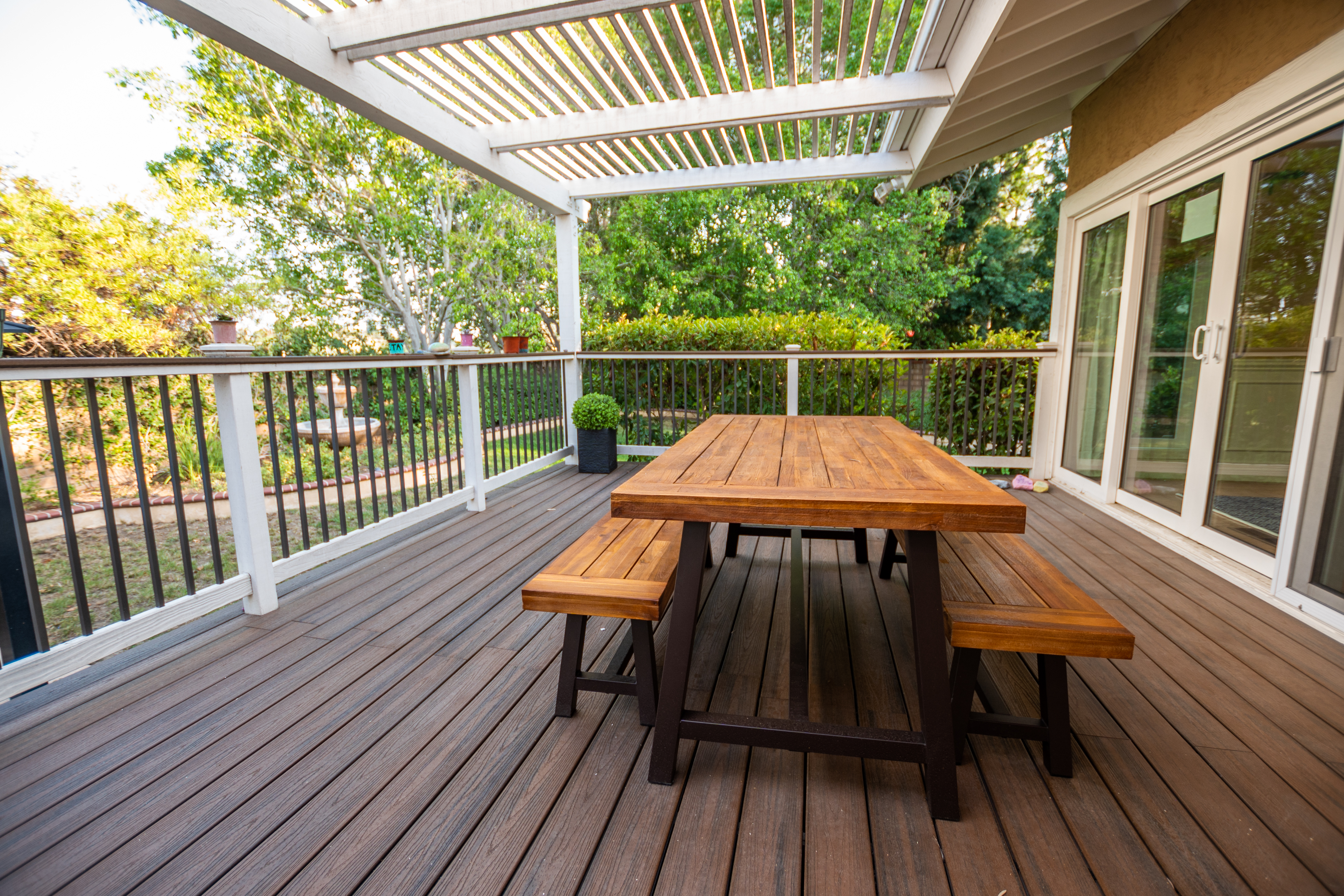 Wooden table and benches on covered deck