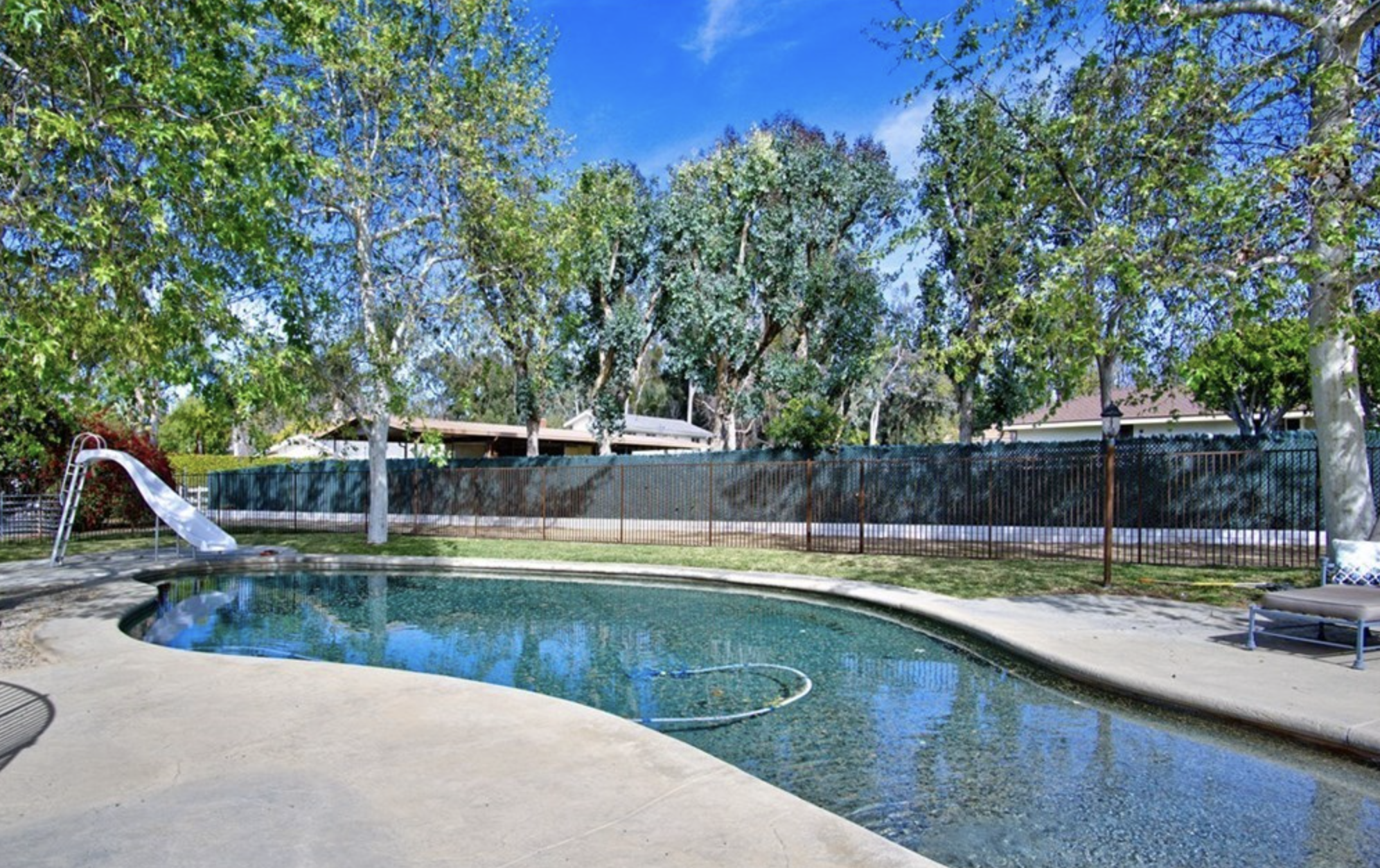 Pool area with slide and seating