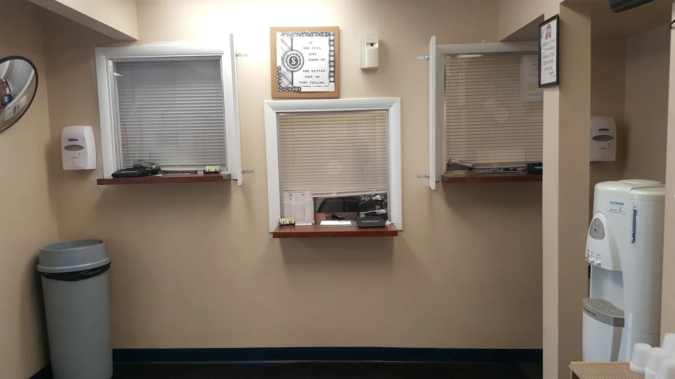 Patient check-in windows with water dispenser and service counter