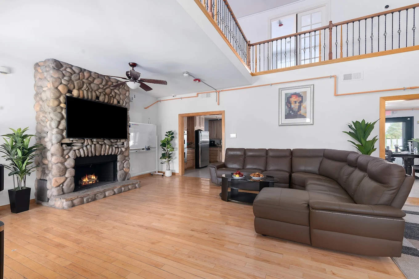 Cozy living room with stone fireplace and sectional sofa