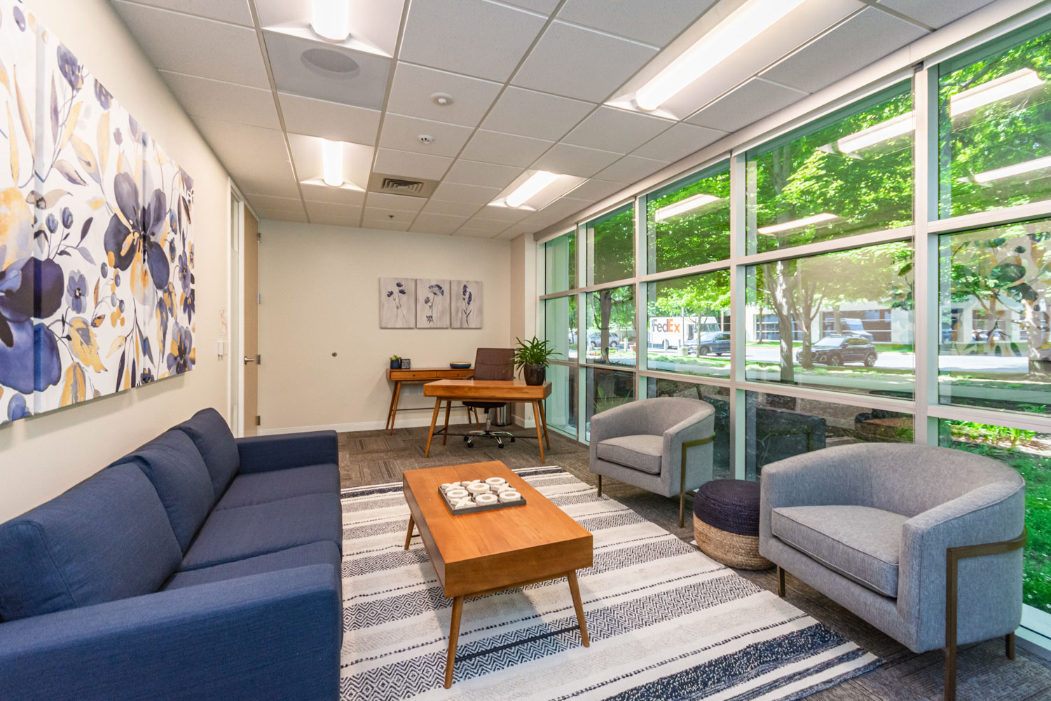Comfortable lounge area with seating and large windows