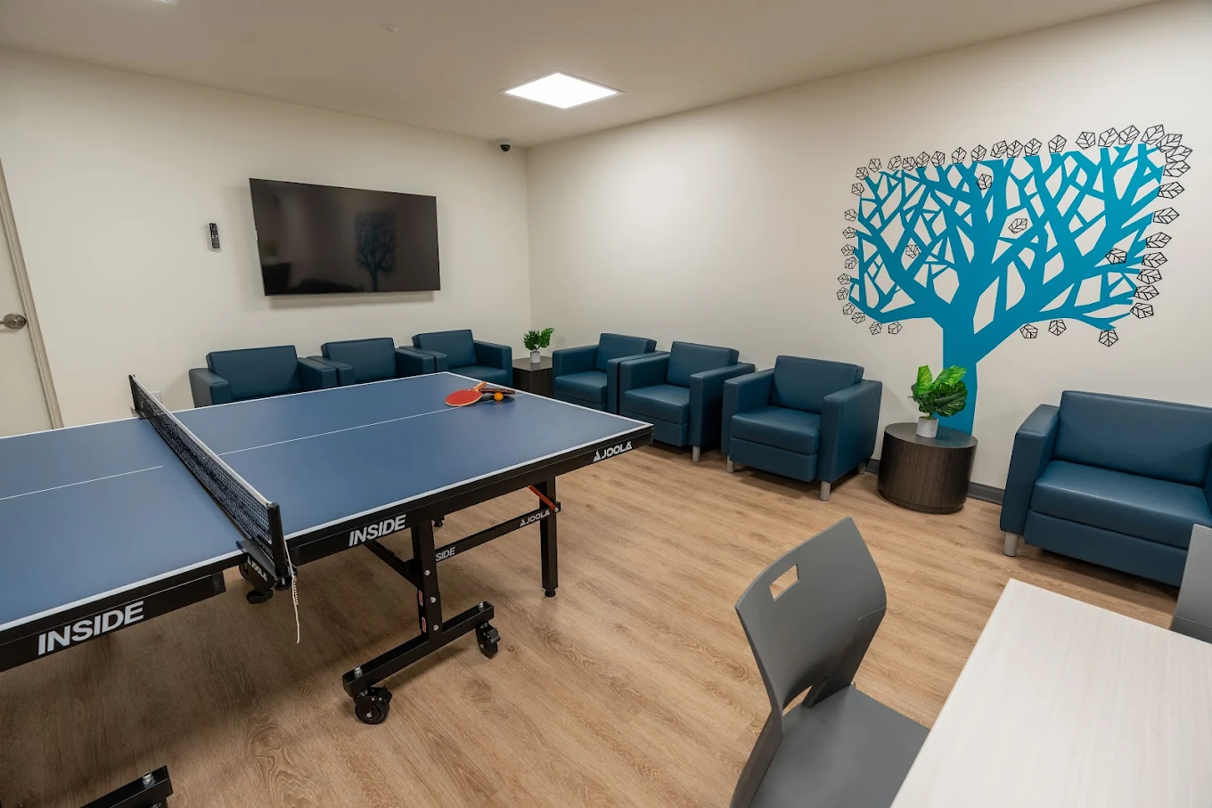 Recreation room with ping pong table and chairs