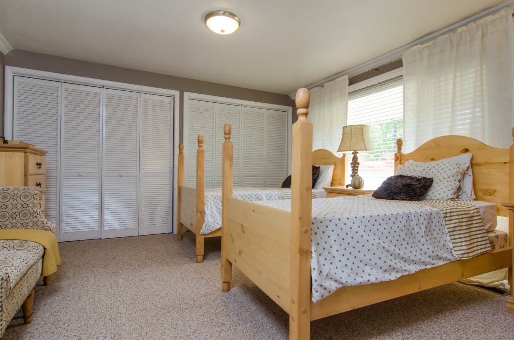 Room with twin beds and bright window