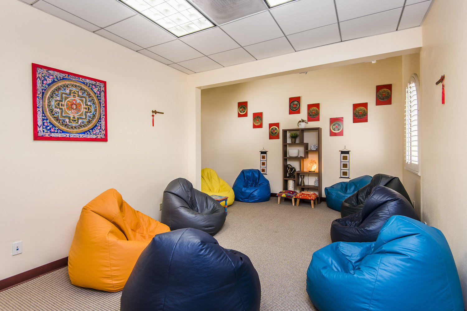 Colorful beanbag room with spiritual décor and wall art
