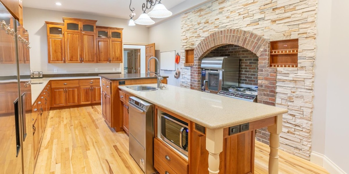 Kitchen with island and brick arch cooking area