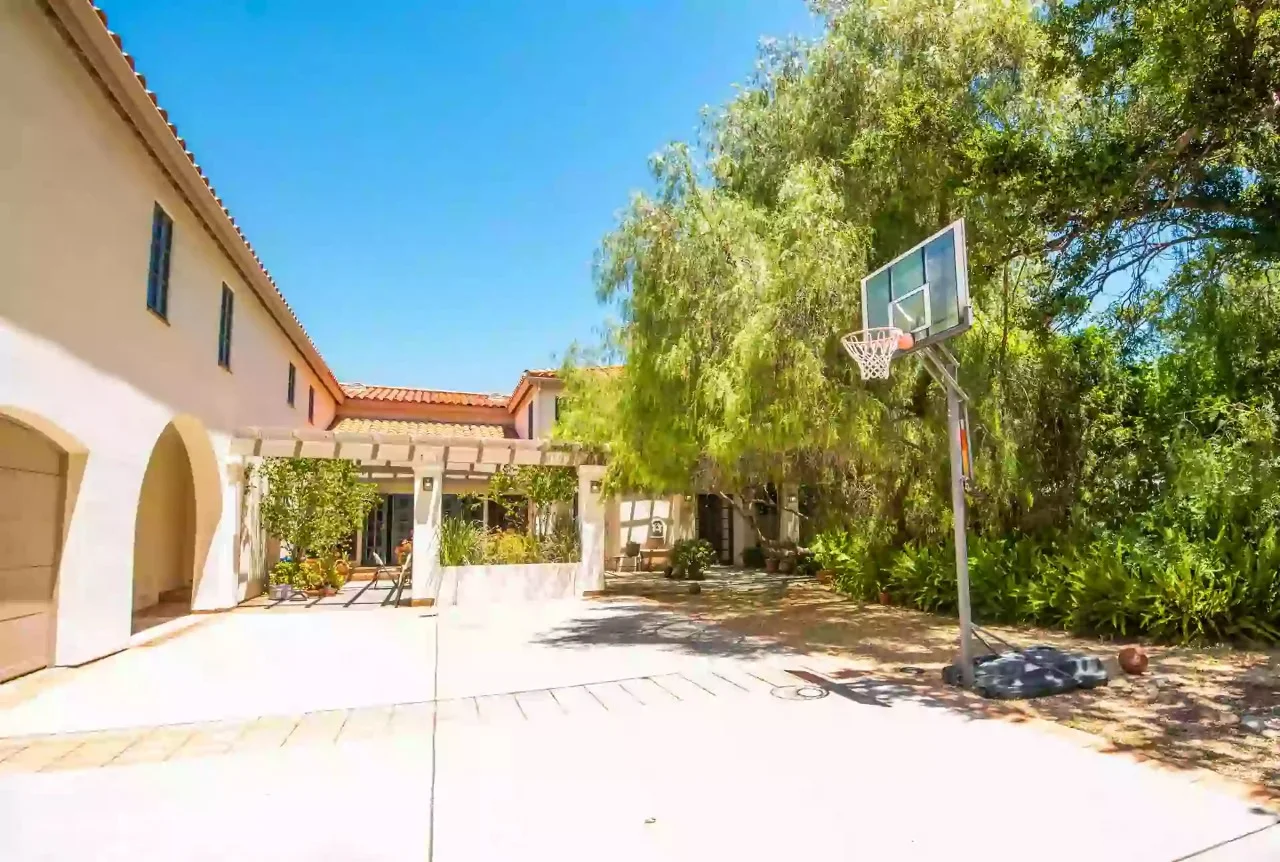 Outdoor basketball hoop in residential courtyard