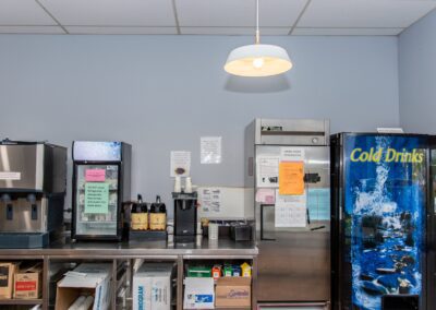 Kitchen beverage station with coffee machines and fridge