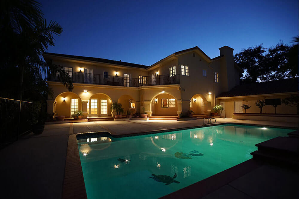 Pool area overlooked by balcony.