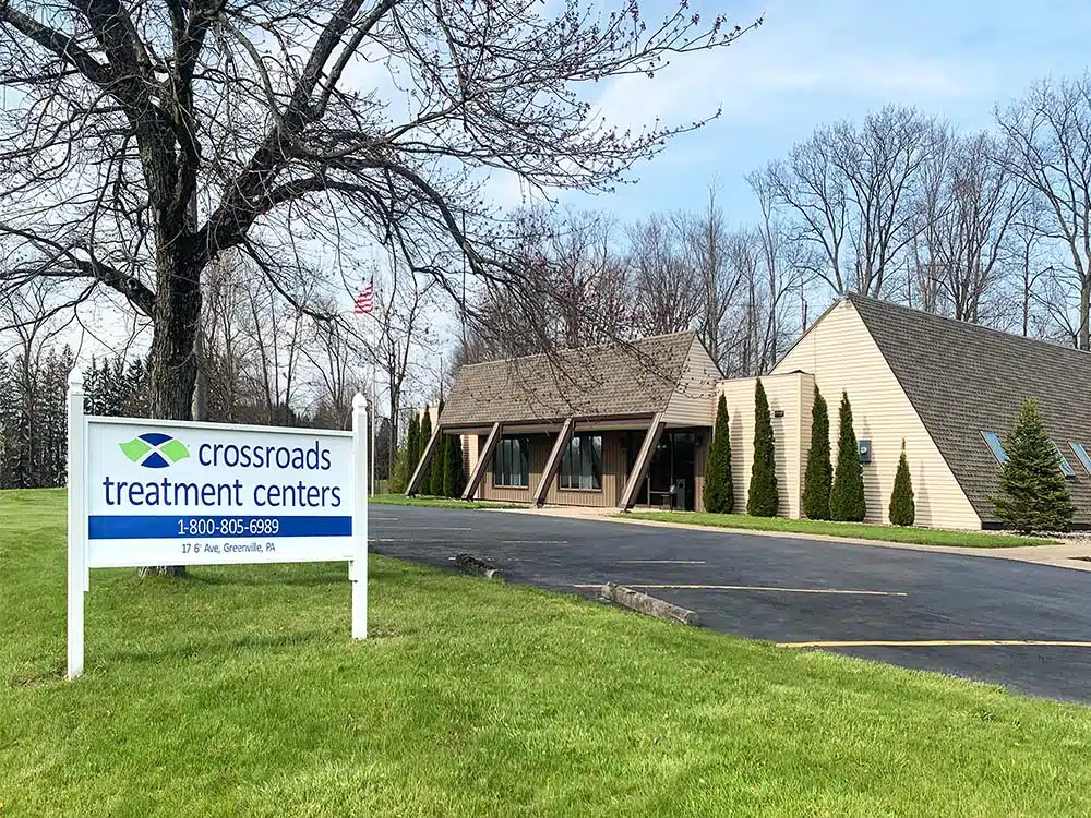 Clinic exterior with sloped roof and front entrance walkway