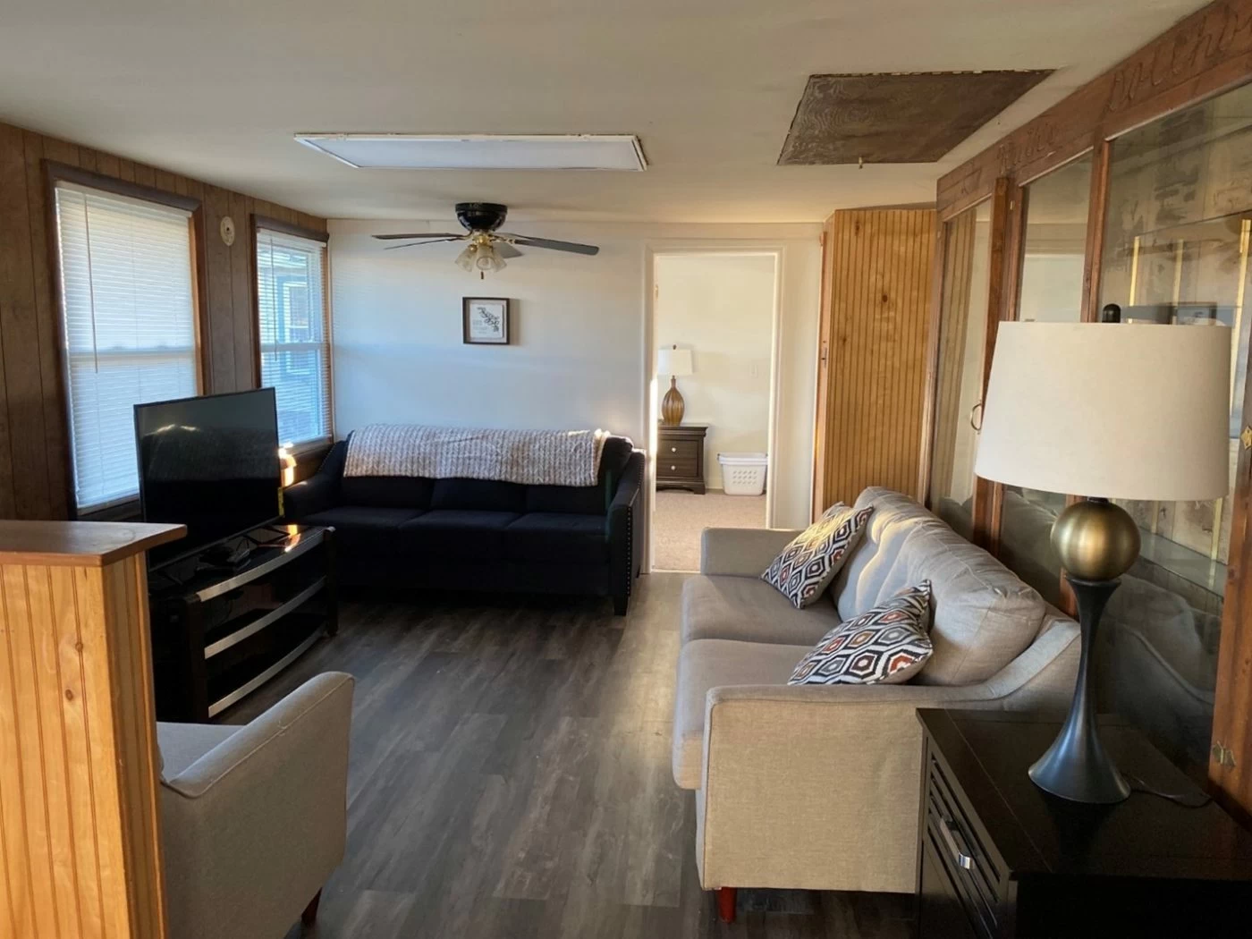 Living space with couch, TV, and soft lighting