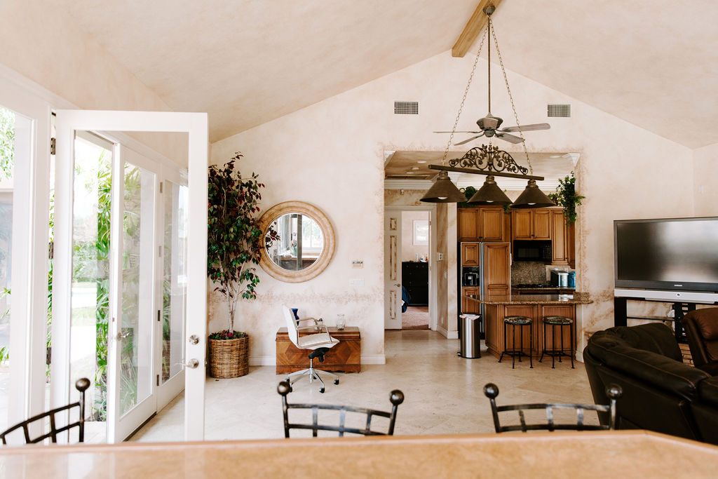 Open living space with kitchen and high ceilings