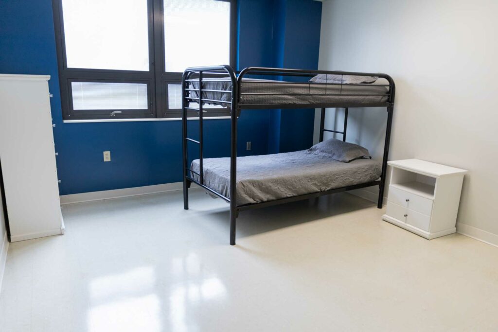 Simple room with bunk bed and nightstand