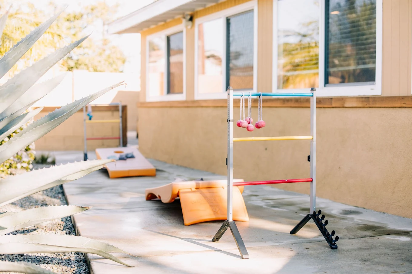 Outdoor lawn games set up on paved yard
