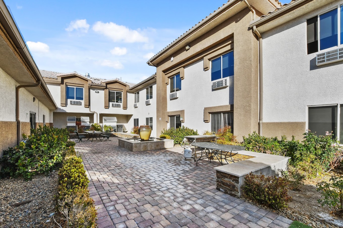 Outdoor courtyard with plants and a relaxing atmosphere