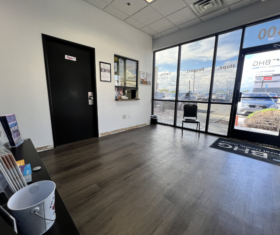 Lobby entrance with reception window and seating