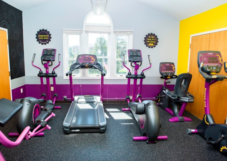 Gym with treadmill, bikes, and ellipticals