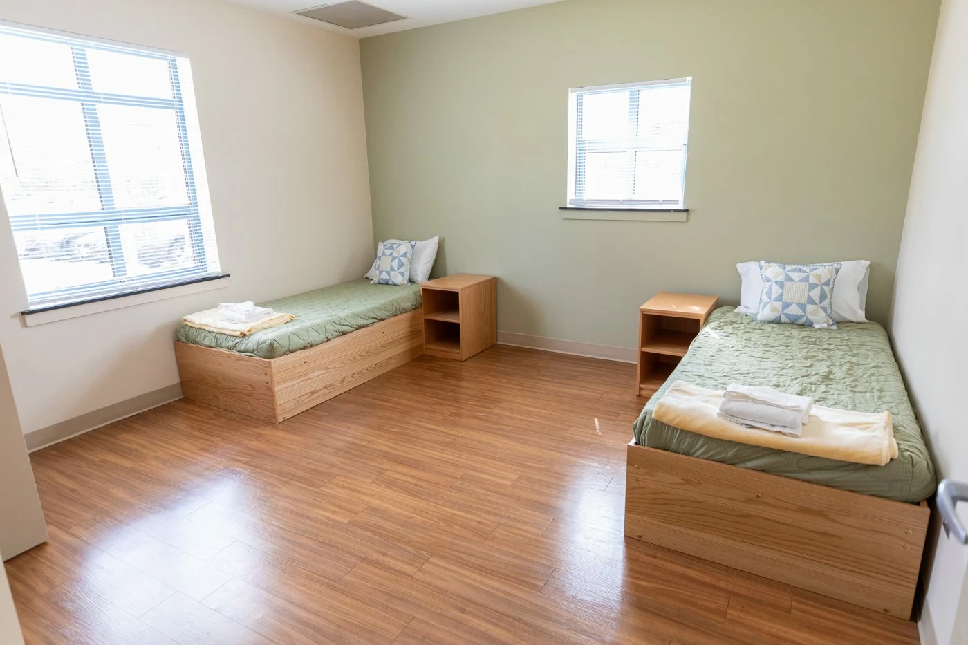 Shared bedroom with twin beds and nightstands