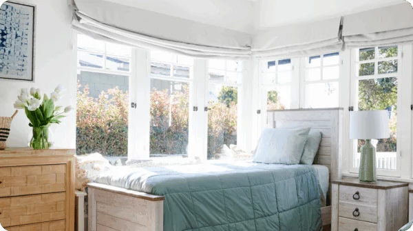 Private bedroom with large windows and natural light