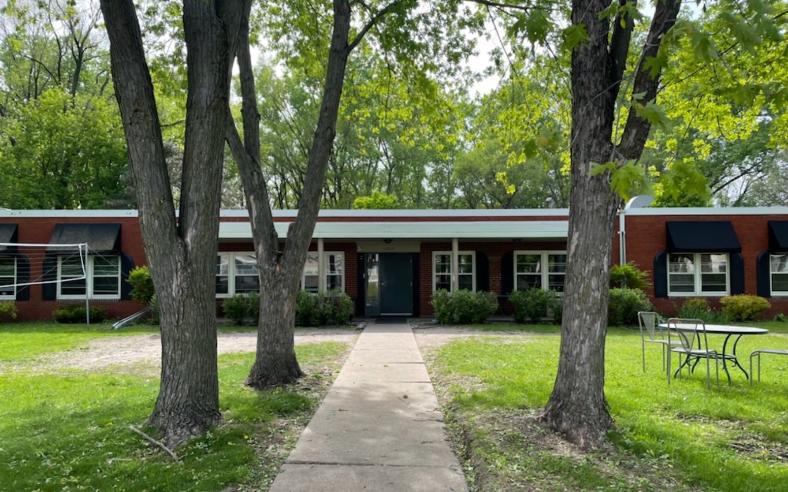 Brick residential treatment building with trees