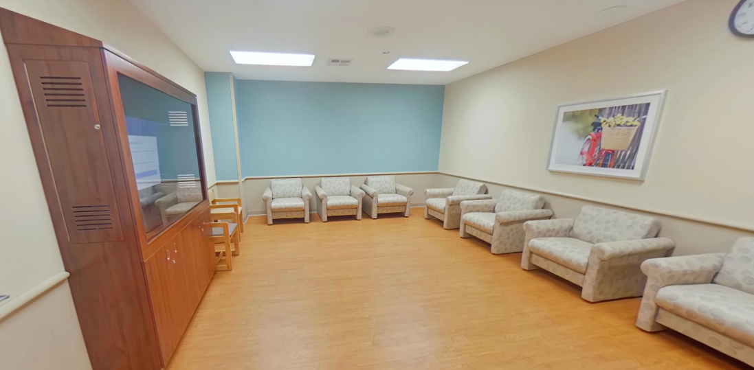Padded chairs arranged in a quiet group TV room