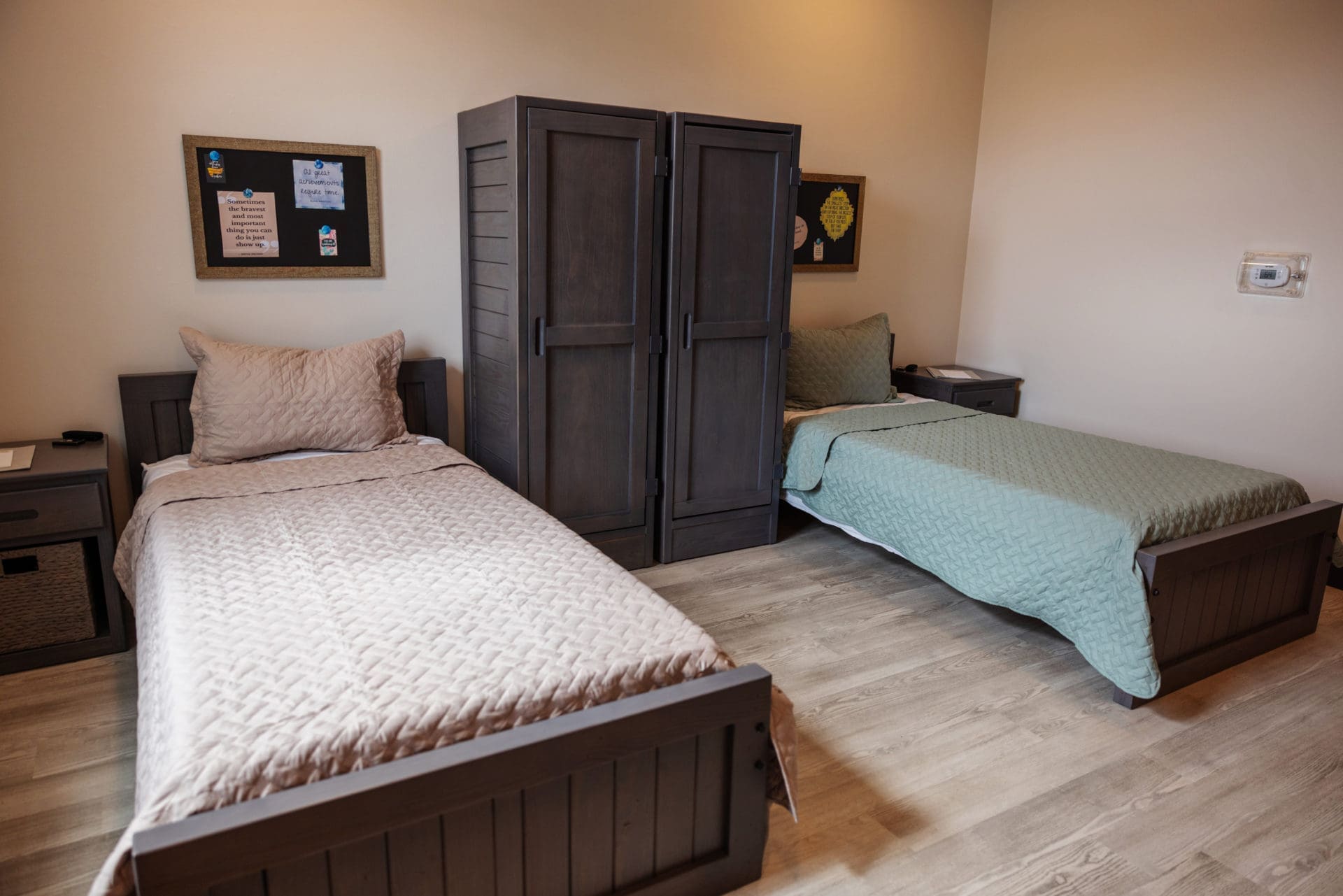 Shared bedroom with two beds and wardrobes for residents