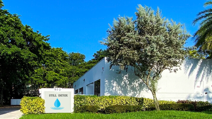 Treatment center exterior on a lawn with signage.