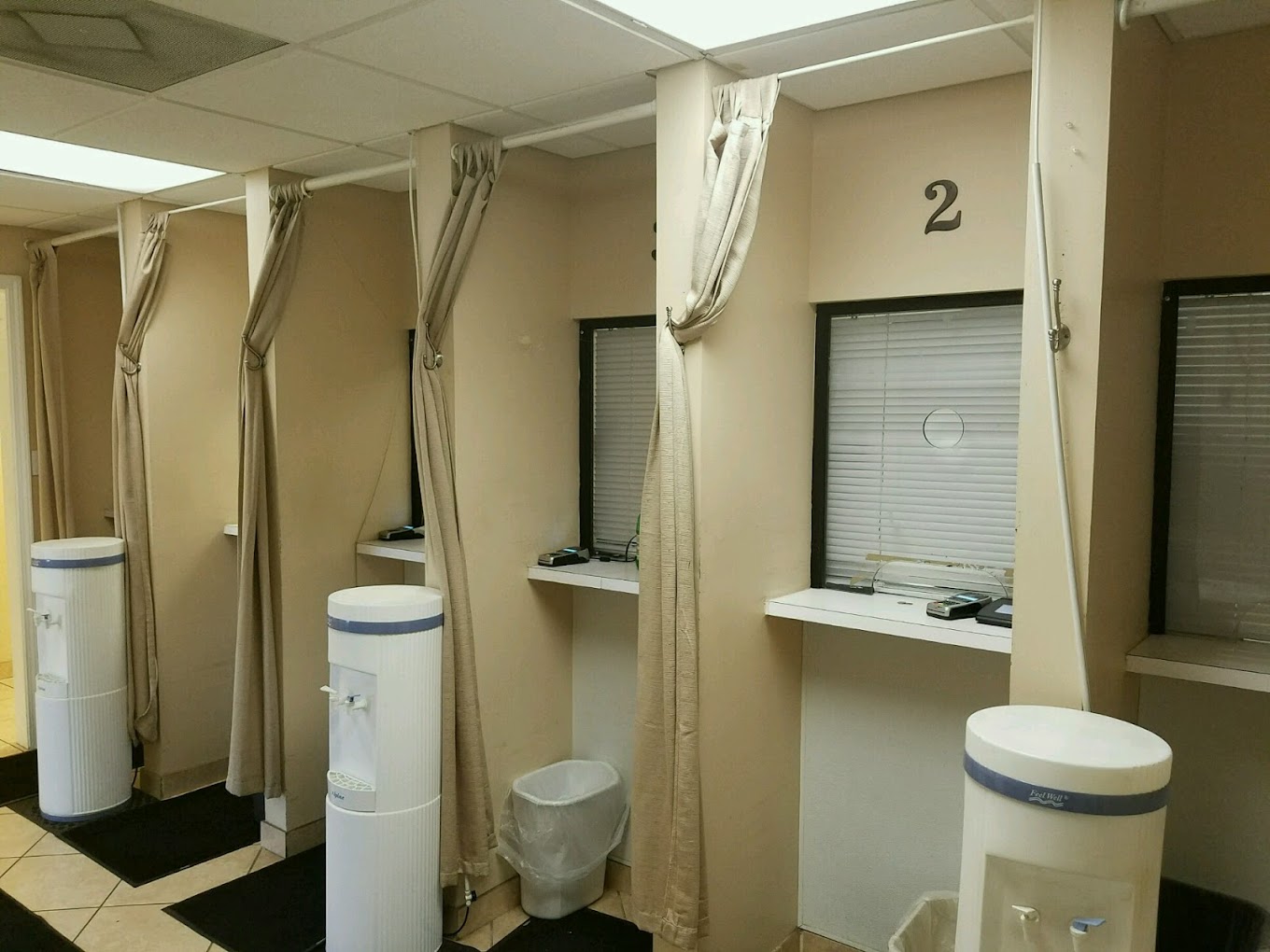 Service booths with white dispensing stations.