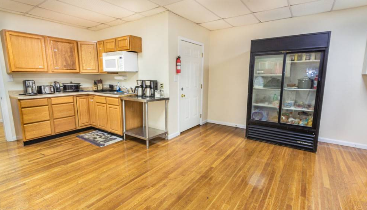 Shared kitchen with cabinets, appliances, and refrigerator