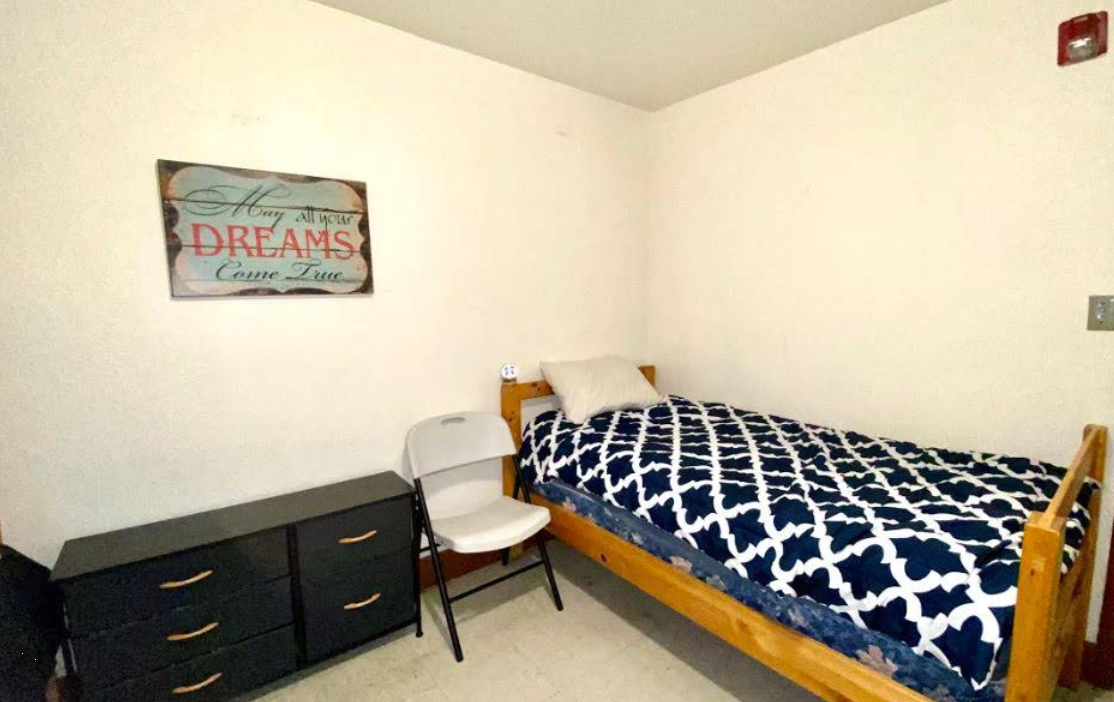 Private bedroom with single bed and dresser