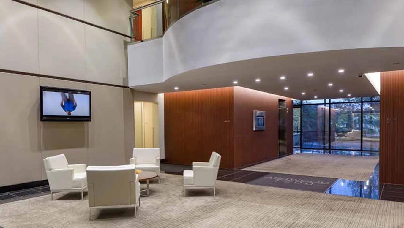 Modern lobby with white chairs and open seating area
