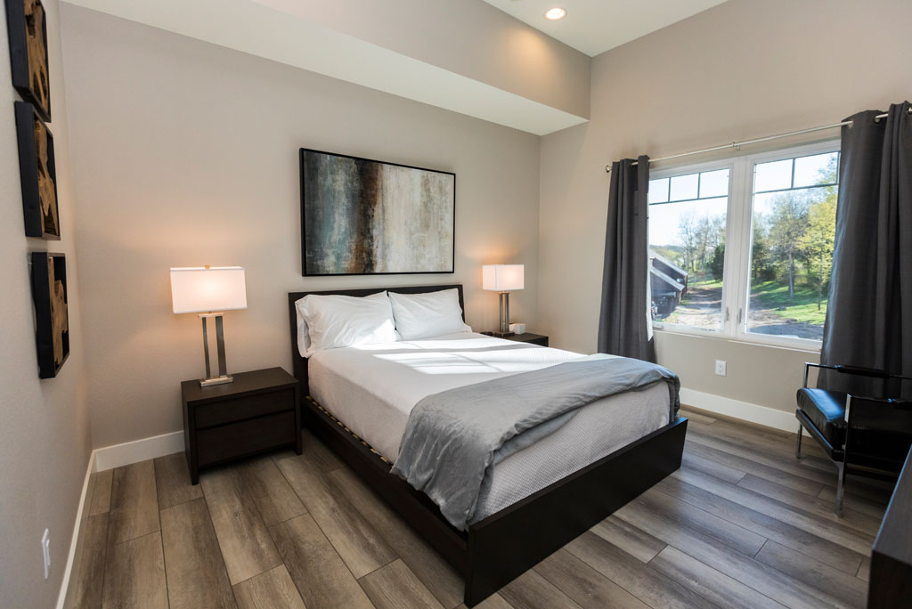 Private bedroom with modern furnishings and natural light