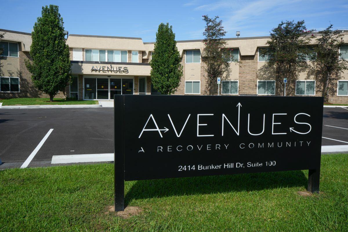 Front view of Avenues Recovery Center with sign and entrance