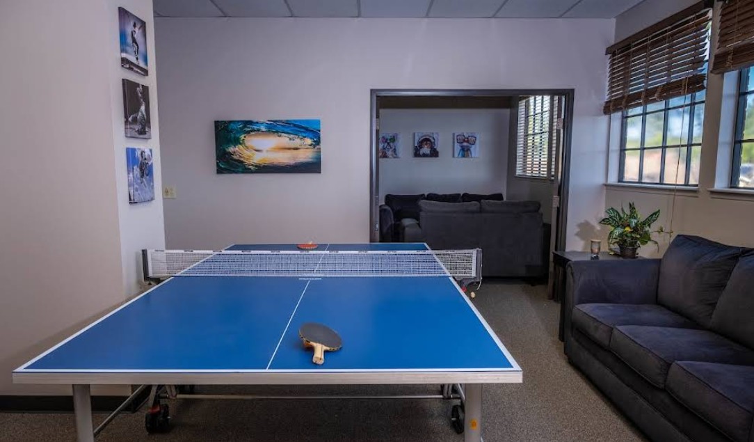Recreation room with ping pong table and lounge seating
