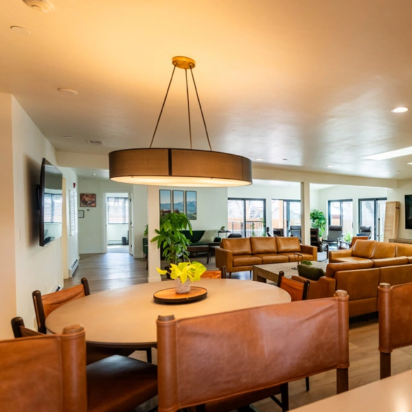 Cozy dining area next to bright living room
