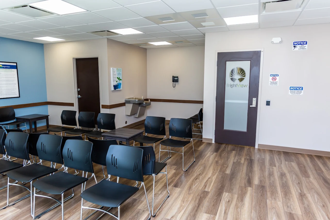 Group meeting room with rows of chairs and small tables