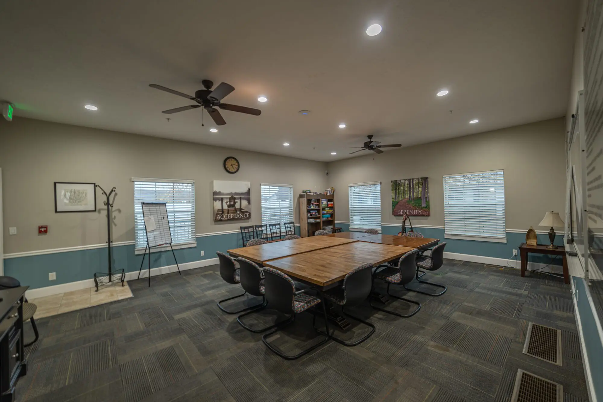 Group therapy room with conference tables and chairs