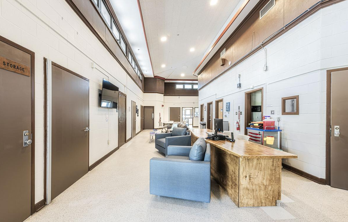 Lobby with seating, reception desk, and offices