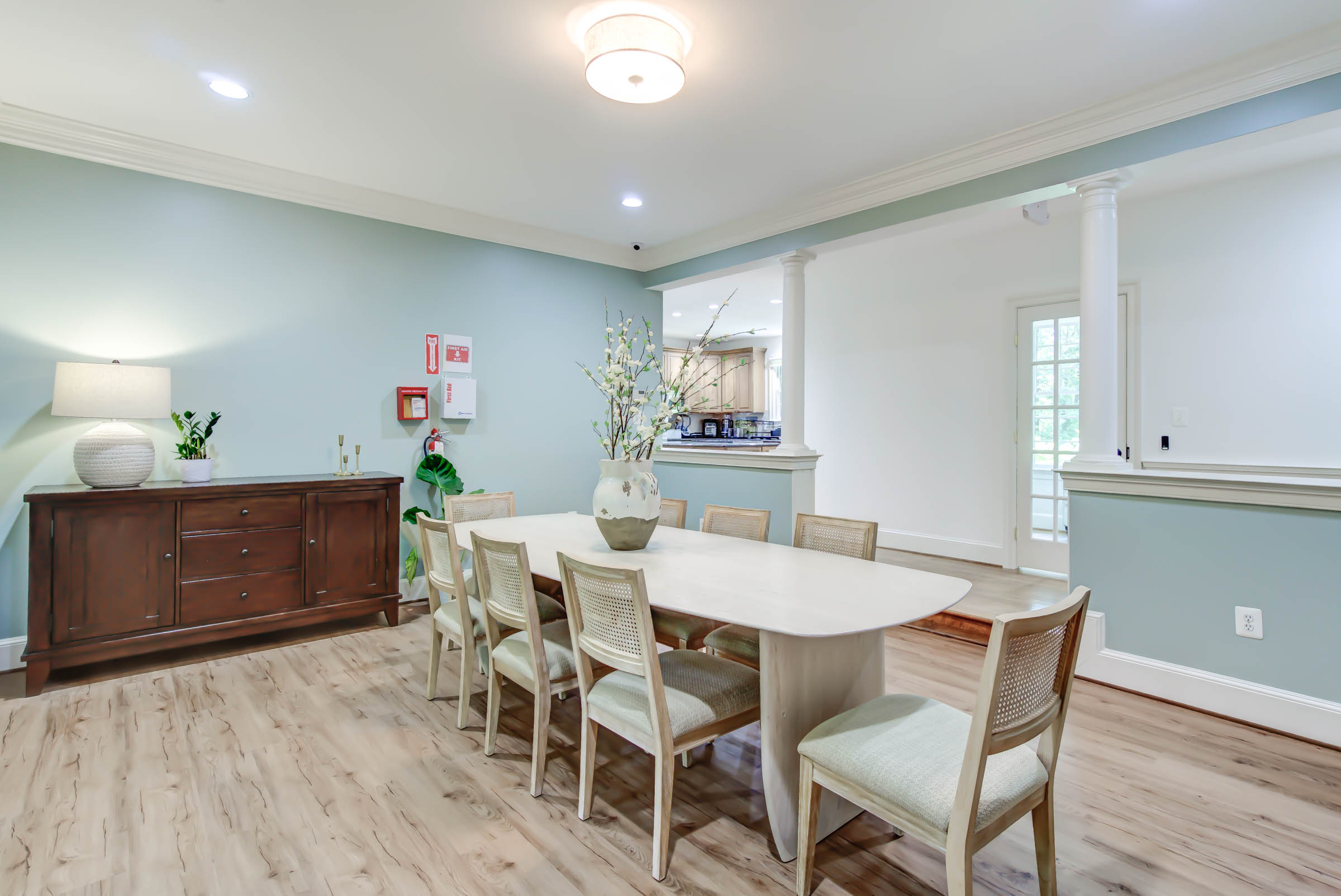 Dining table for ten with soft lighting and decor.
