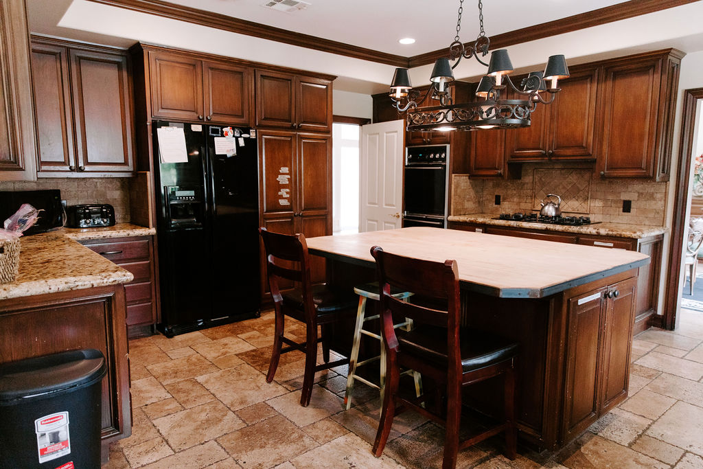 Spacious kitchen with wooden cabinets and island