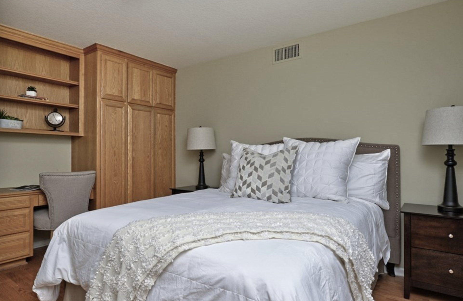 Private bedroom with bed and side-tables.