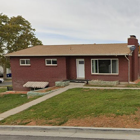 Single-story brick building with front lawn and sidewalk at Active Recovery Centerville
