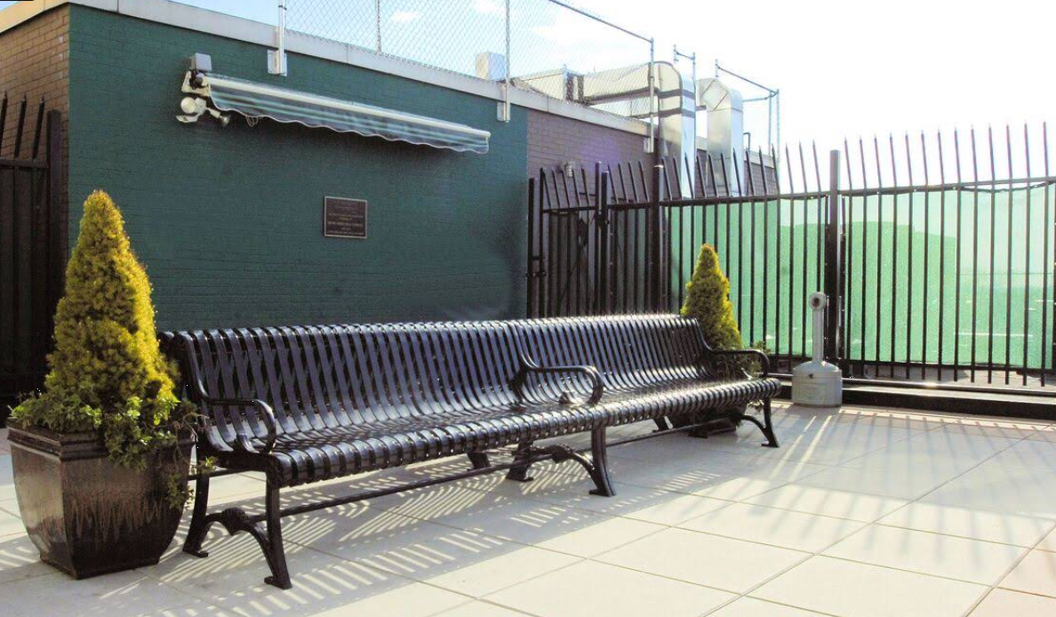 Outdoor seating area with bench and plants