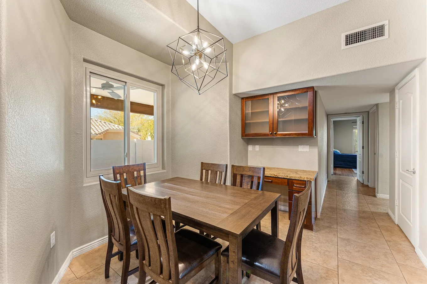 Dining area with wooden table and seating for six