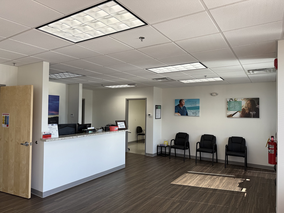 Lobby with reception desk and waiting chairs