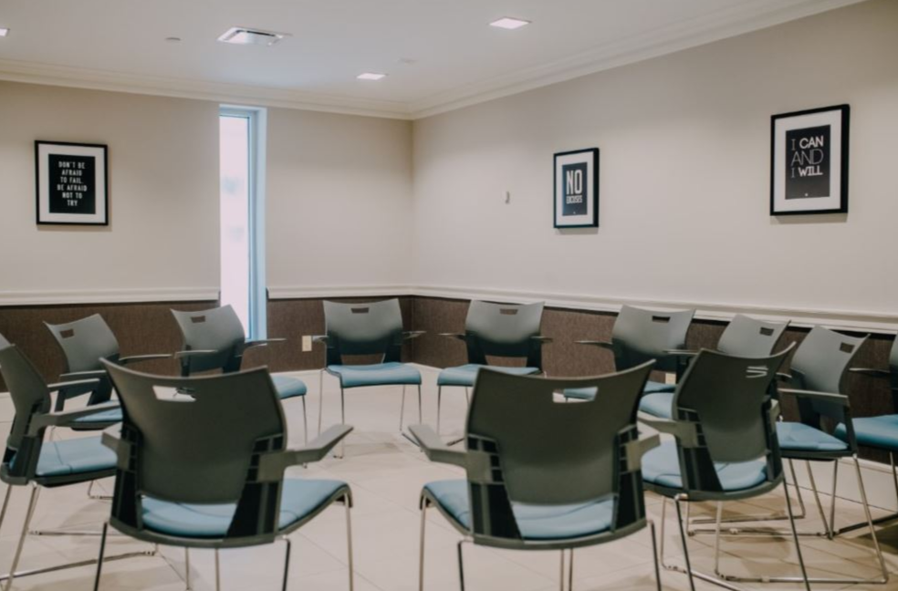 Circle of chairs arranged for group therapy sessions