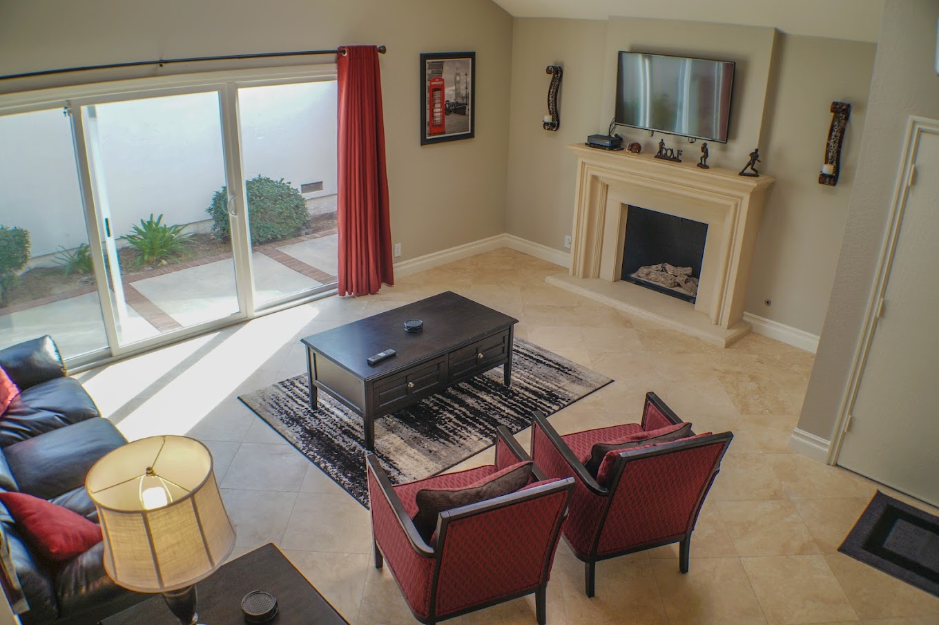 Lving room with a fireplace and seating.