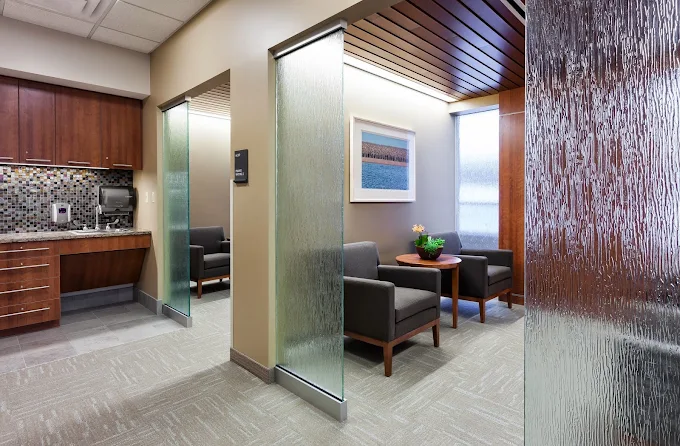 Private office with two armchairs and warm, modern décor