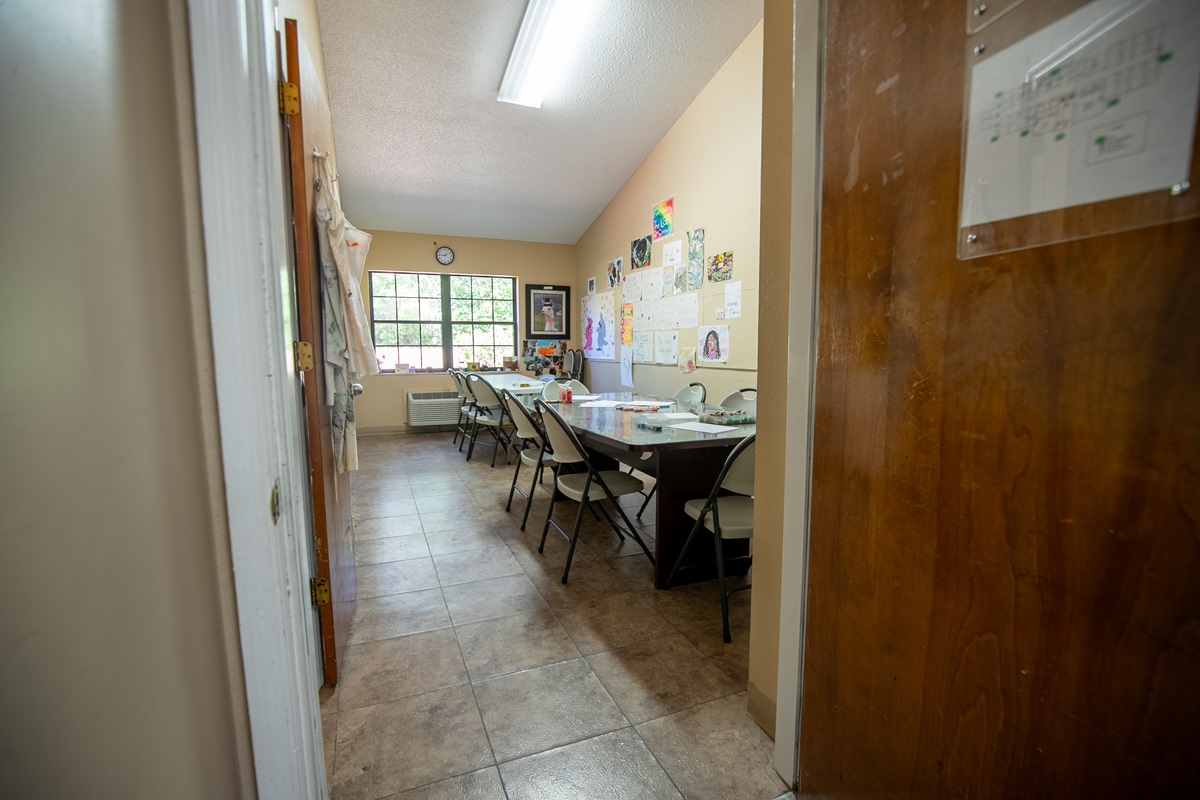 Creative space with art-covered walls and fold-out chairs