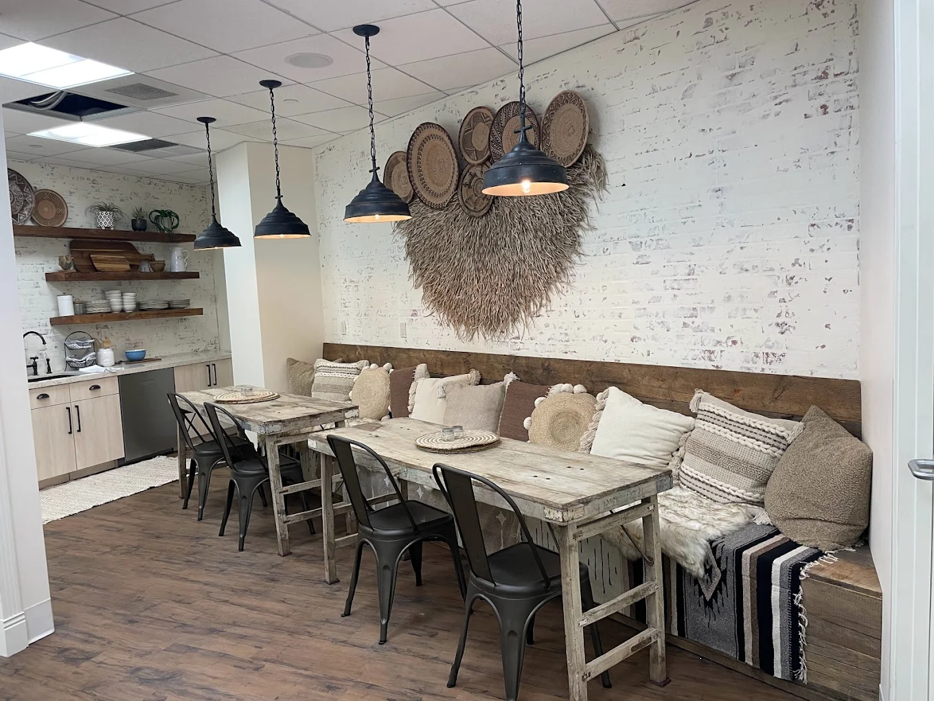 Rustic tables with bench seating and textured wall décor
