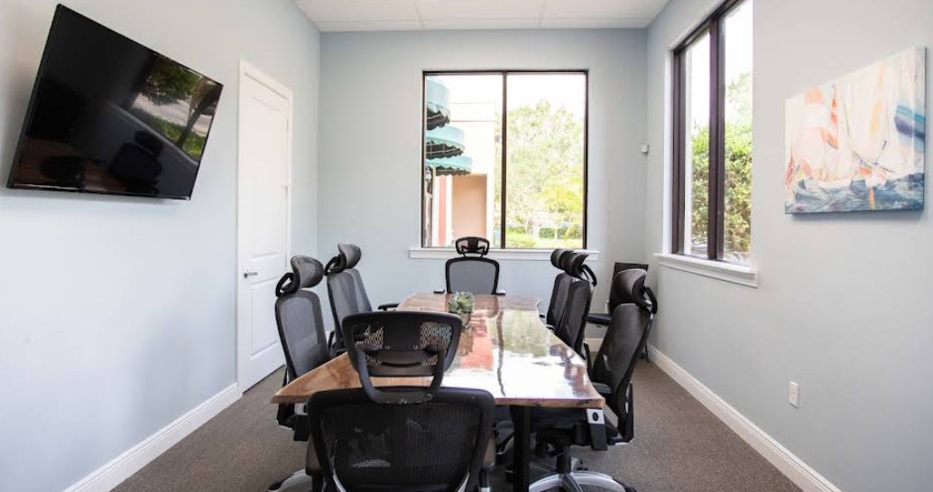 Conference room with meeting table and office chairs